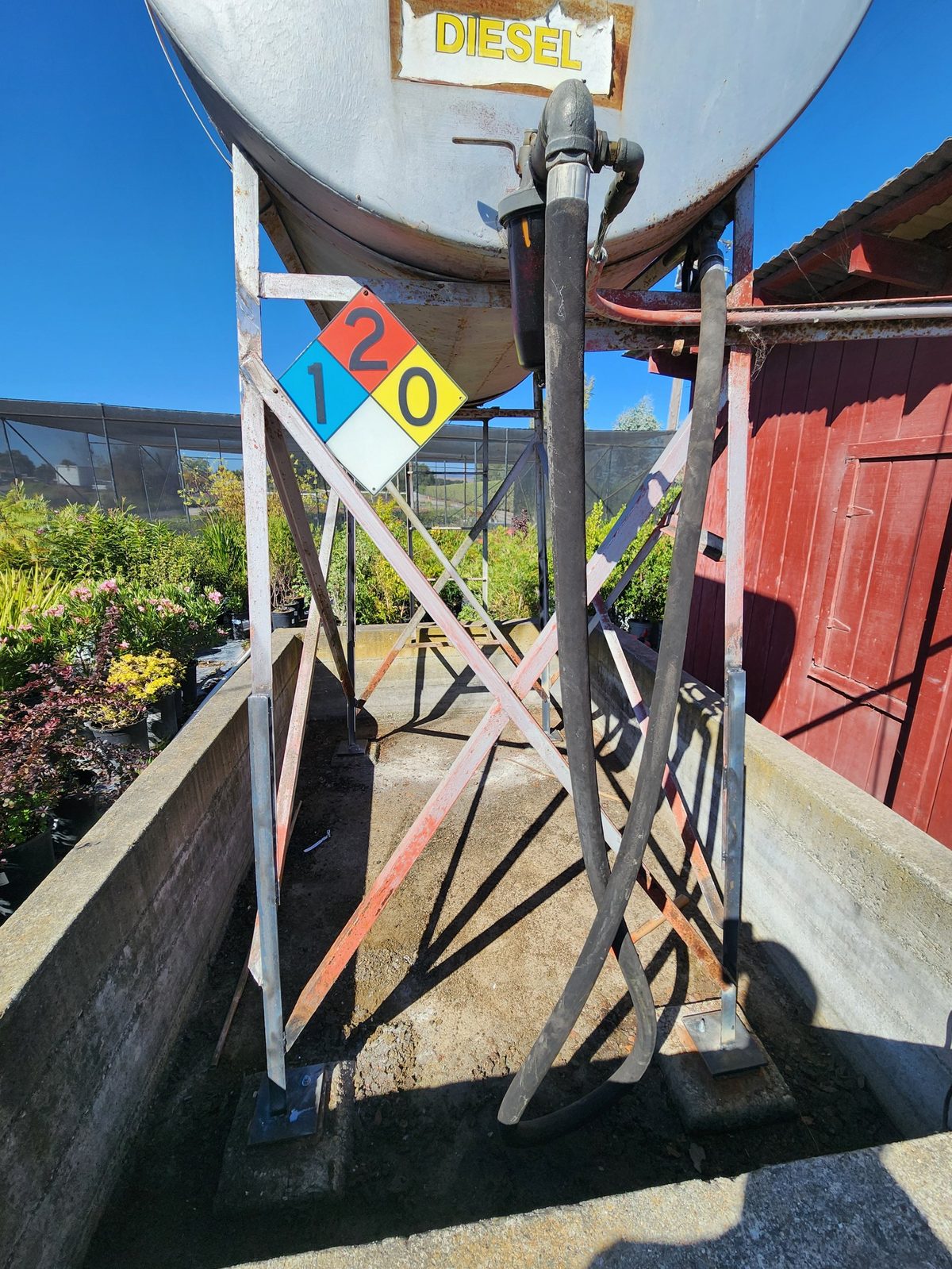 Diesel tank on its repaired steel stand after the corner post repair, Sonoma County
