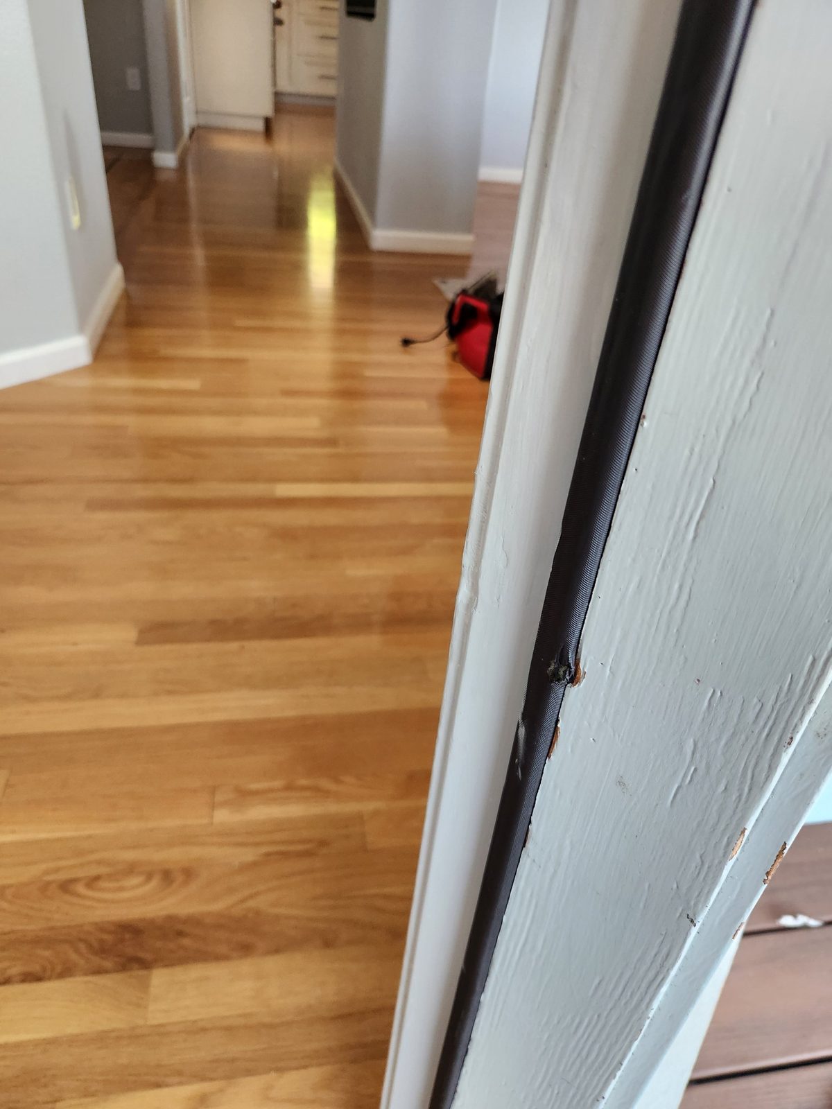 Splintered, damaged wood on a door frame in Santa Rosa before repair