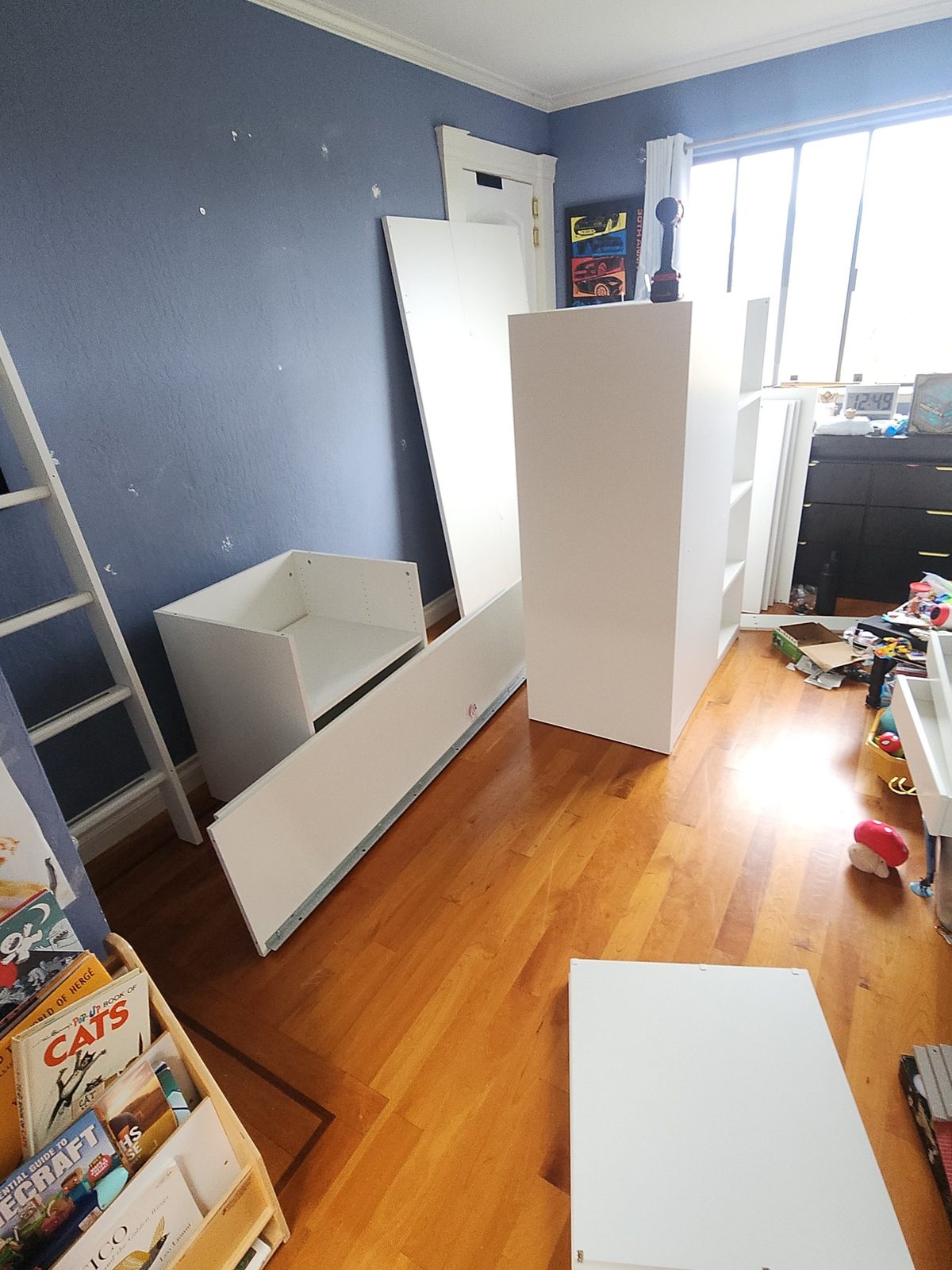 Loft bed and desk furniture fully disassembled into panels before being moved upstairs in Santa Rosa