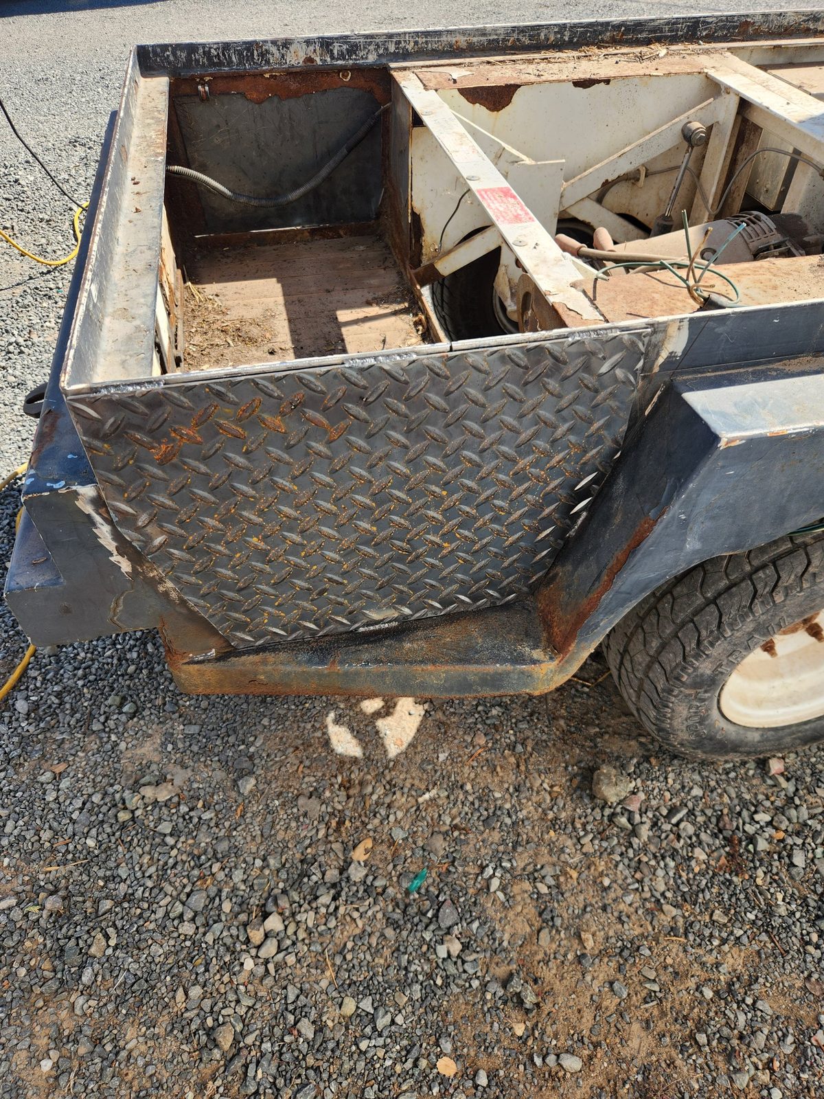 New welded steel patch on a golf cart battery compartment