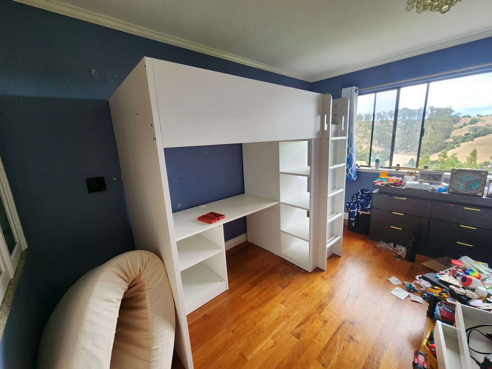 Loft bed with desk and shelving fully reassembled in the upstairs bedroom in Santa Rosa