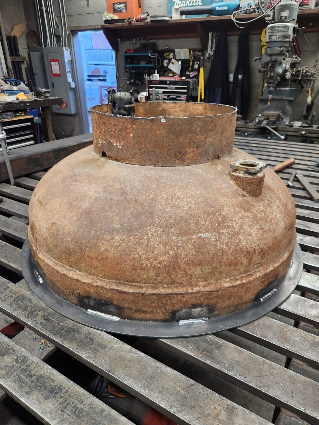 Tank bowl with a steel base ring welded around it