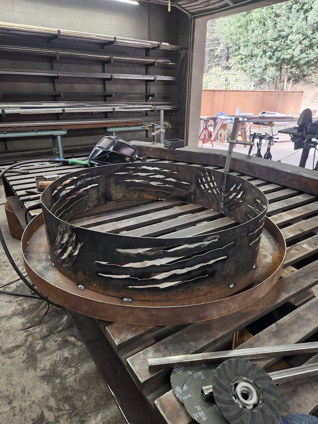 Claw-cutout band sitting on the base ring, ready for final welding
