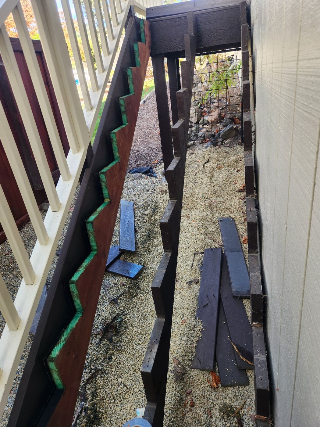 Removed decking boards and demo pile from the stair repair