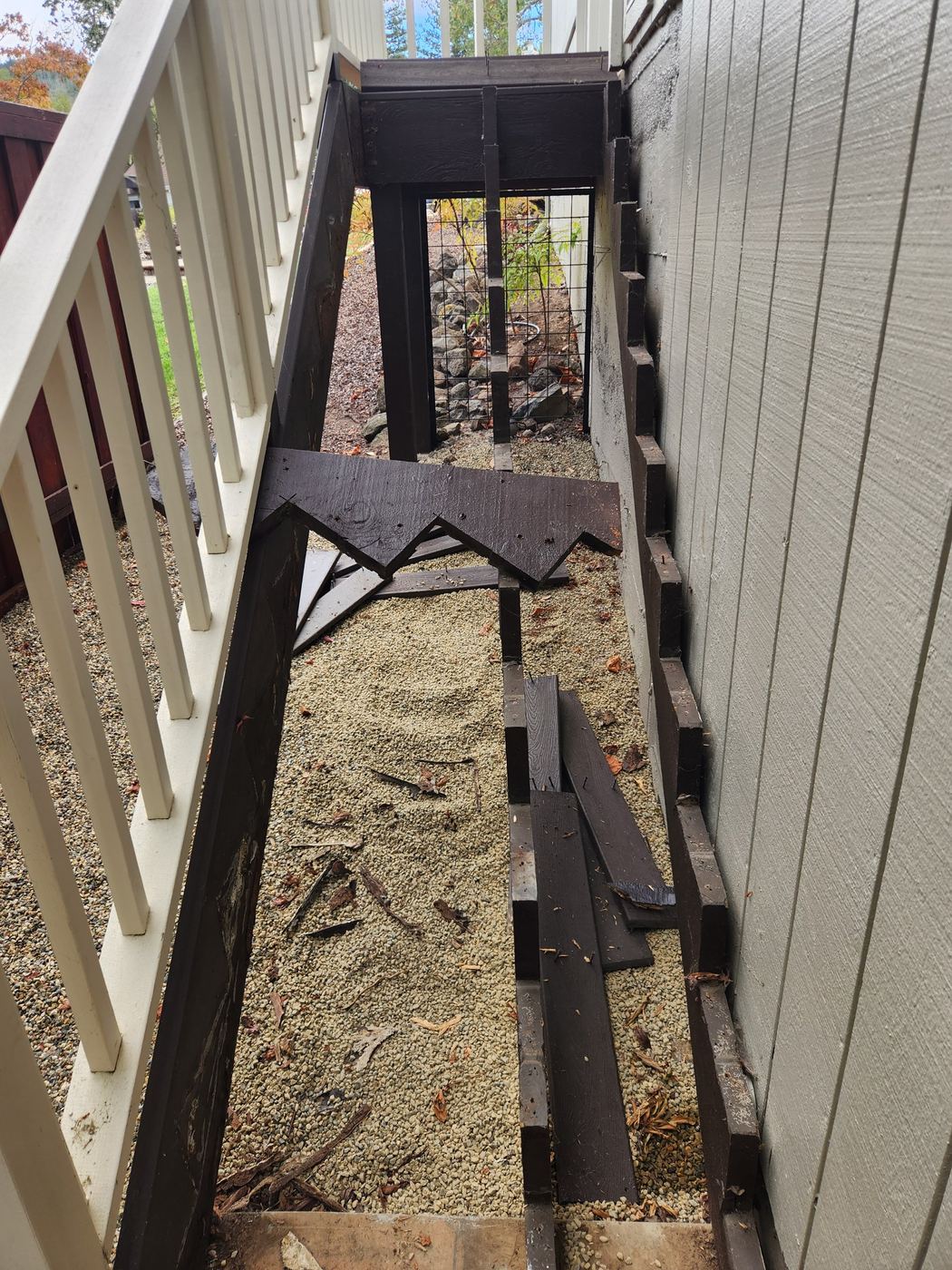 Rotted exterior stair stringer exposed after removing damaged decking boards in Santa Rosa