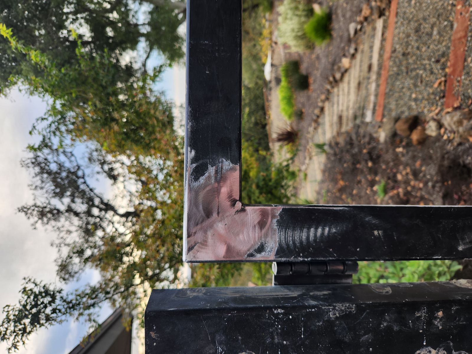 Close-up of a fully welded and ground steel gate frame corner