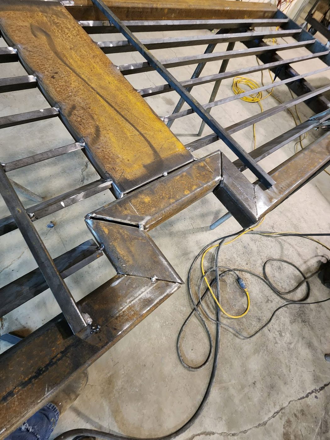Close-up of the finished corner weld on the same mesh gate