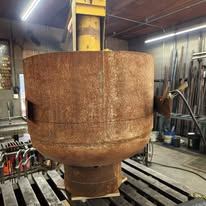 Propane tank cut and shaped into the finished custom fire pit