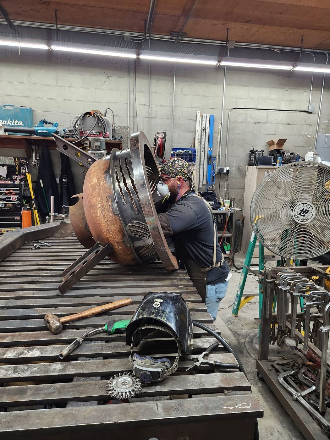 Grinding and finishing the custom propane tank fire pit