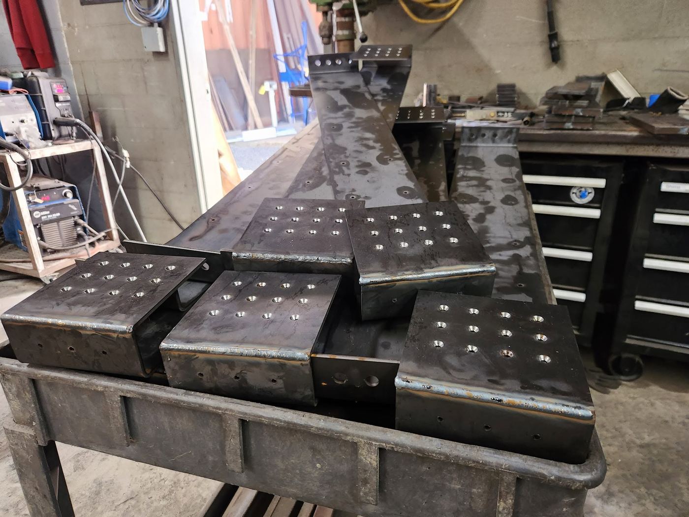 Batch of six custom-welded steel base plates